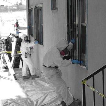 Absolute Mitigation Services - Technicians performing Lead abatement on exterior windows in Los Angeles Rehab project. - Damage Restoration Near Me - Bakersfield, California