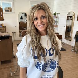 2 rows of 18" extensions. Her natural hair is fine, so 2 rows for fullness and length