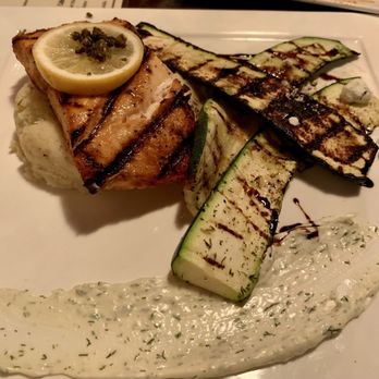 The Purple Door - Grilled salmon dish with zucchini and mashed potatoes. - New American Near Me - Harlan, Iowa