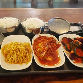 Bulgogi and Ramen - Side with stew: bean sprouts, Kimchi, zucchini and beets. Bowls  of rice - Korean Near Me - Temecula, California