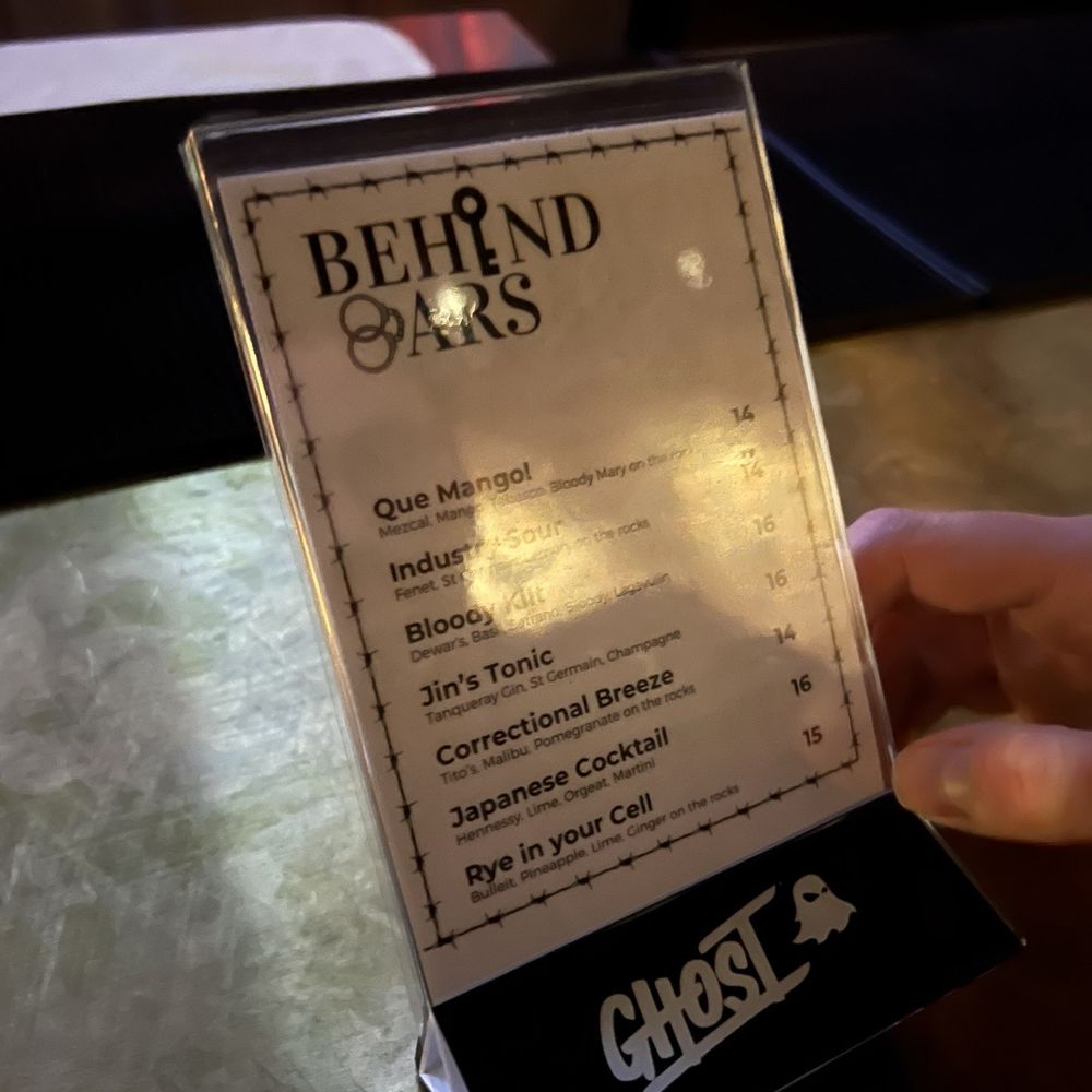 Behind Bars - a hand holding a menu card - Bars Near Me - Pasadena, California Behind Bars - a hand holding a menu card - Bars Near Me - Pasadena, California