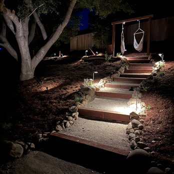 Bajascape - Walk path, lighting, swings, stone border - Landscaping Near Me