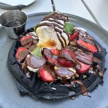 Parakeet Cafe - Del Mar - Charcoal Waffle Activated charcoal Belgian waffle, date coconut cream, strawberries, banana, house-made granola, house-made nutella - Coffee & Tea Near Me - San Diego, California Parakeet Cafe - Del Mar - Charcoal Waffle Activated charcoal Belgian waffle, date coconut cream, strawberries, banana, house-made granola, house-made nutella - Coffee & Tea Near Me - San Diego, California