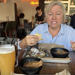My wife loving the food