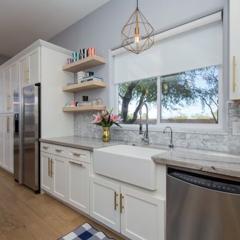 Desert Valley Concepts - a kitchen with white cabinets and stainless steel appliances - General Contractors Near Me - Peoria, Arizona