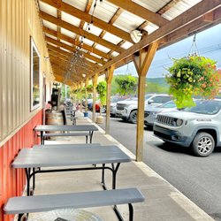 Honey Hole Winery - Picnic Tables in front of entrance.