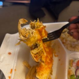 A chicken enchilada. Dry microwaved and not worthy of eating