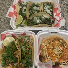 Steak and chorizo tacos and a pupusa.