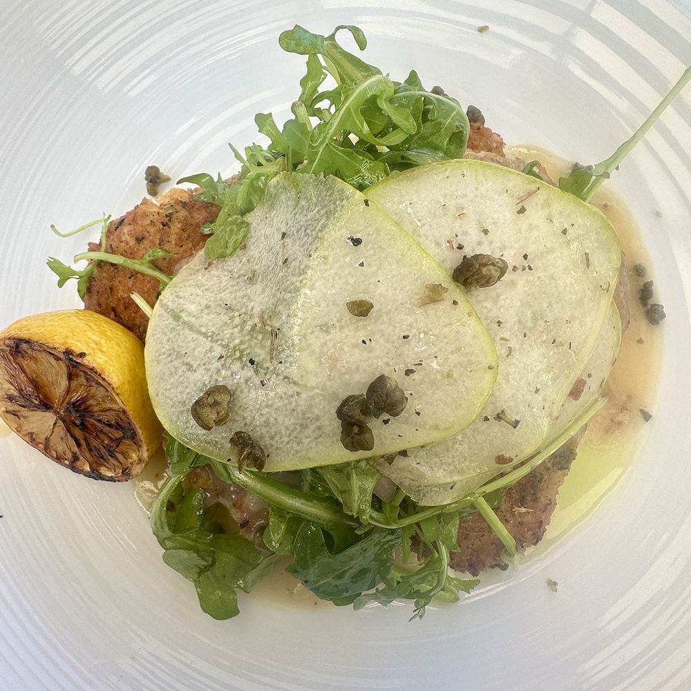 The Grove Kitchen & Gardens - Chicken Milanese topped with a pear arugula salad - American Near Me - Tyler, Texas The Grove Kitchen & Gardens - Chicken Milanese topped with a pear arugula salad - American Near Me - Tyler, Texas