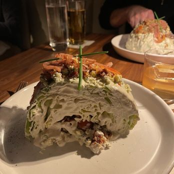 Marbled & Fin - This is half the wedge salad (the other half is in the background)! It's a huge salad. - Seafood Near Me - Charleston, South Carolina Marbled & Fin - This is half the wedge salad (the other half is in the background)! It's a huge salad. - Seafood Near Me - Charleston, South Carolina