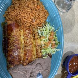 Agavales Mexican restaurant - Kathy's plate 1) Taco, guacamole, (1) Tamale, (2) Cheese Enchiladas served with rice and beans