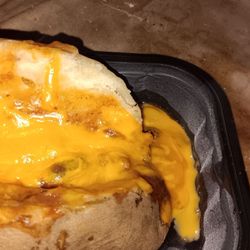 Wendy's - Chili cheese potato with a tablespoon of chili hiding under the cheese. This is so much better at any other Wendy's