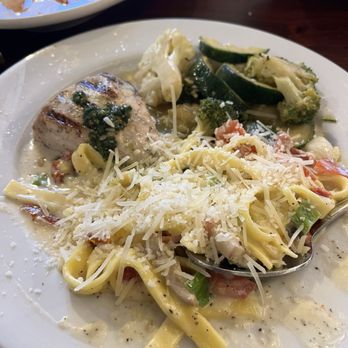 Monterey's Fish House - Oak grilled swordfish topped with pesto, paired with creamy linguini and fresh vegetables (split portion) - Seafood Near Me - Monterey, California