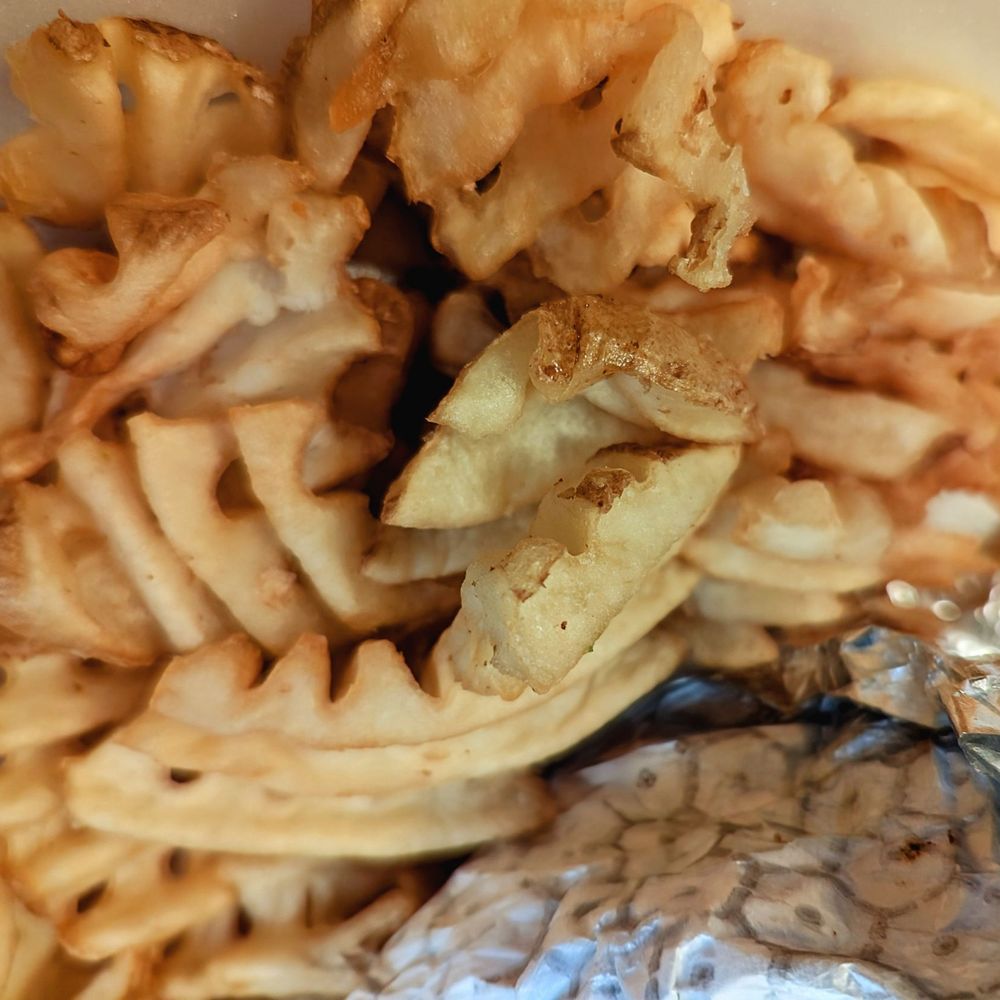Pluckers Wing Bar - South Lamar - Close up of Waffle Fries - Chicken Wings Near Me - Austin, Texas Pluckers Wing Bar - South Lamar - Close up of Waffle Fries - Chicken Wings Near Me - Austin, Texas