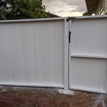 Mila Construction - a white gate and a bike - General Contractors Near Me Mila Construction - a white gate and a bike - General Contractors Near Me