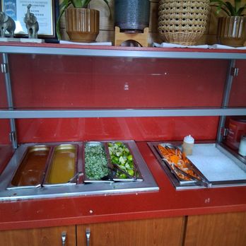 Tacos Los Guero - Salsa bar with onions, cilantro, limes, and cured carrots with onion slices. - Mexican Near Me - Norwalk, California Tacos Los Guero - Salsa bar with onions, cilantro, limes, and cured carrots with onion slices. - Mexican Near Me - Norwalk, California