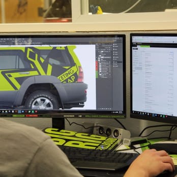 CW Wraps - Designer working on a vehicle wrap. - Advertising Near Me - Post Falls, Idaho CW Wraps - Designer working on a vehicle wrap. - Advertising Near Me - Post Falls, Idaho