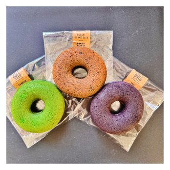 Ring Donuts - (From left) Green-Pandan, Caramel/brown-Black sesame, Purple-Ube. - Donuts Near Me - Los Angeles, California