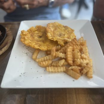 El Machetico - A side/ acompañantes: Fried green plantains (tostones) and french fries (papas fritas) - Breakfast & Brunch Near Me - Miami, Florida El Machetico - A side/ acompañantes: Fried green plantains (tostones) and french fries (papas fritas) - Breakfast & Brunch Near Me - Miami, Florida