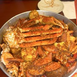 Sakura Sushi Bar & Asian Cuisine - Seafood boil, juicy special sauce medium heat. With snow crab, sausage, crawfish, lobster tail, shrimp, corn, and potatoes