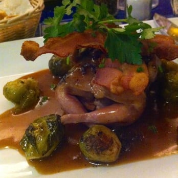 Brussels Bistro - Stuffed quail with roasted brussel sprouts. - Belgian Near Me - Laguna Beach, California Brussels Bistro - Stuffed quail with roasted brussel sprouts. - Belgian Near Me - Laguna Beach, California