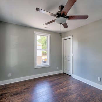 Hutson Construction - an empty room with a ceiling fan - General Contractors Near Me - Wilmington, North Carolina Hutson Construction - an empty room with a ceiling fan - General Contractors Near Me - Wilmington, North Carolina