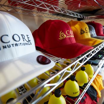 Dulles Nutrition Corner - a rack of caps and hats - Vitamins & Supplements Near Me - Sterling, Virginia