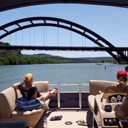 Sun & Fun Watercraft Rentals - Great views on Lake Austin of the rusting bridge.