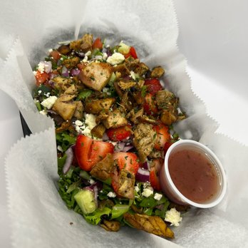 The Squeeze Station - a salad in a basket with dressing - Juice Bars & Smoothies Near Me - Detroit, Michigan The Squeeze Station - a salad in a basket with dressing - Juice Bars & Smoothies Near Me - Detroit, Michigan