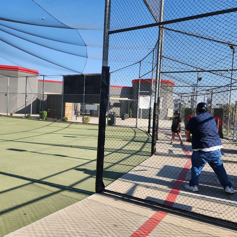 MB2 Entertainment - My husband and our oldest at the batting cages - Venues & Event Spaces Near Me - Bakersfield, California