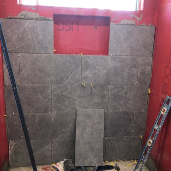 Fred Handyman - The tiles 24 x 12" and I build shelf middle of the walls. For Shampoo - Handyman Near Me Fred Handyman - The tiles 24 x 12" and I build shelf middle of the walls. For Shampoo - Handyman Near Me