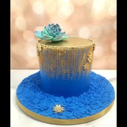 Sugar And Magic Cake Company - Gorgeous little 6" birthday cake covered in blue fondant with a top edible gold painted stencil design and a sugar succulent.