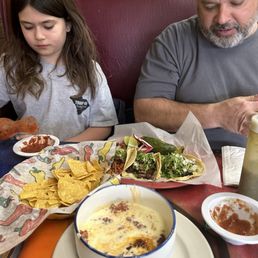a man and a little girl eating a man and a little girl eating