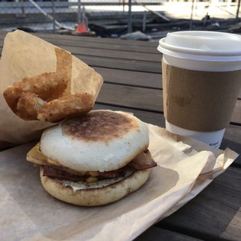 Iggy's Eggies - bread, egg, cheese, & meat (English muffin, American, ham), hash browns, coffee. Eaten at Capitol Park - Breakfast & Brunch Near Me - Detroit, Michigan