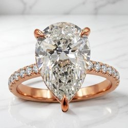 Pear shape diamond engagement ring in 14k rose gold