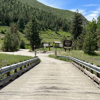 Kirkham Hot Springs - Bridge over river into springs. Pay area. Day use only $5 - Lakes Near Me - Lowman, Idaho Kirkham Hot Springs - Bridge over river into springs. Pay area. Day use only $5 - Lakes Near Me - Lowman, Idaho