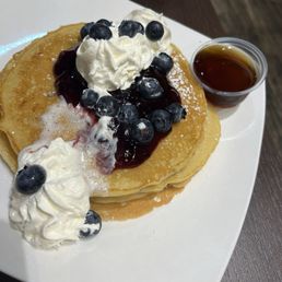 Blueberry pancakes signature stacks $12.49 with side of pure Canadian maple syrup $1.49