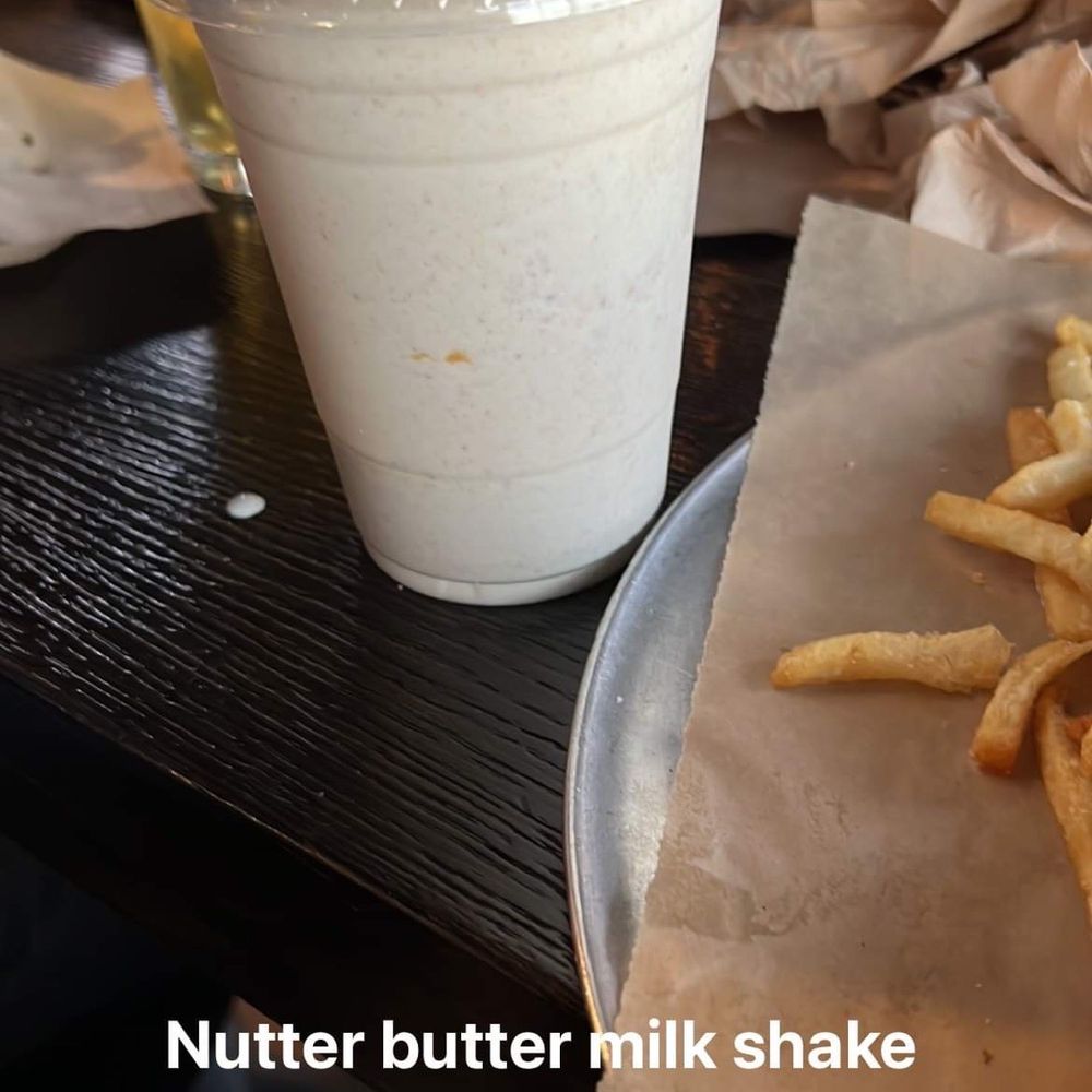 Knockabout Burgers - Nutter butter milk shake in front and strawberry milk shake in the back - Burgers Near Me - Denver, Colorado Knockabout Burgers - Nutter butter milk shake in front and strawberry milk shake in the back - Burgers Near Me - Denver, Colorado