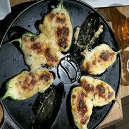 Home made poppers served in cast iron skillet.