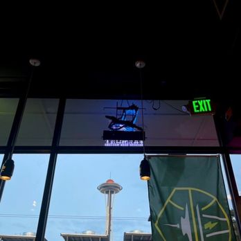 Uptown Hophouse - Space Needle view from the bar seating area inside. - Sports Bars Near Me - Seattle, Washington