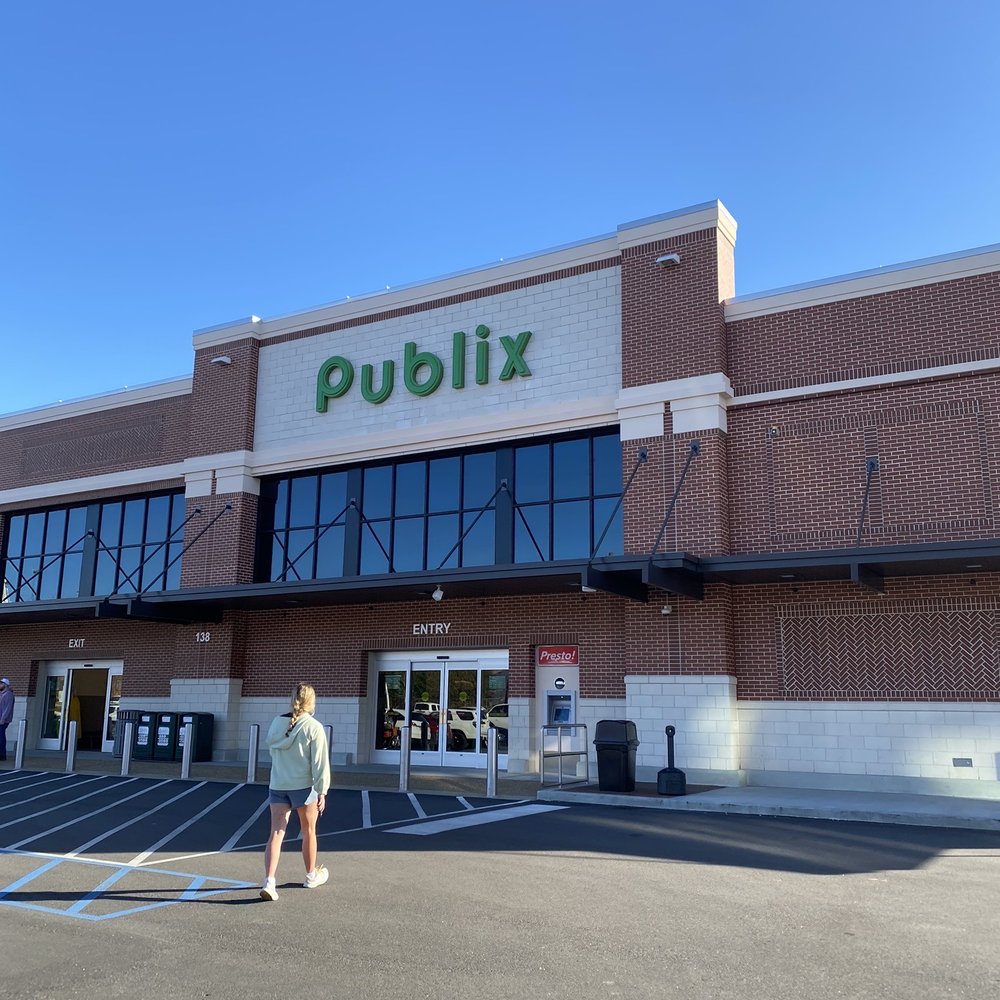 Publix - a woman walking in front of a publix store - Grocery Near Me - Auburn, Alabama Publix - a woman walking in front of a publix store - Grocery Near Me - Auburn, Alabama