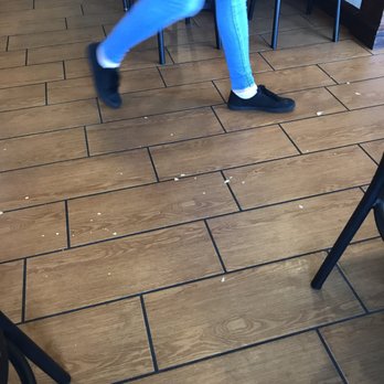 McAlister's Deli - Potato chips all over the floor and the employee swept "near" us but still walked all over the remaining mess. - Delis Near Me - Midlothian, Virginia