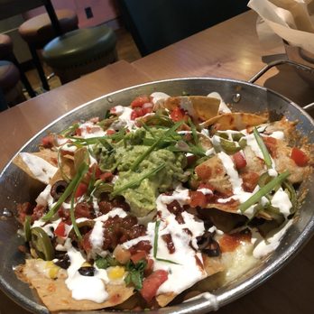 Cactus Restaurants - Nachos. Effin hot handles. Be really really careful not to touch it trying to get it closer to you bc u will burn your hands!! - Tex-Mex Near Me - Bellevue, Washington