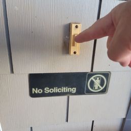 There is no way to miss that sign when you ring the doorbell . There is no way to miss that sign when you ring the doorbell .
