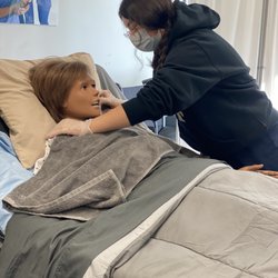 Professional Career Institute - Student polishing her skills during her CNA program.