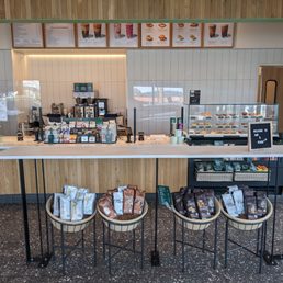 a coffee shop with a counter and stools a coffee shop with a counter and stools