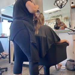 Sola Salon - Working her magic making clients hair fabulous.