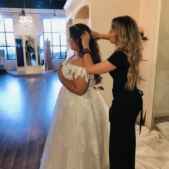 J Bridal Boutique - Emily adding a hair piece to help with envisioning the whole look. - Bridal Near Me - Tucson, Arizona