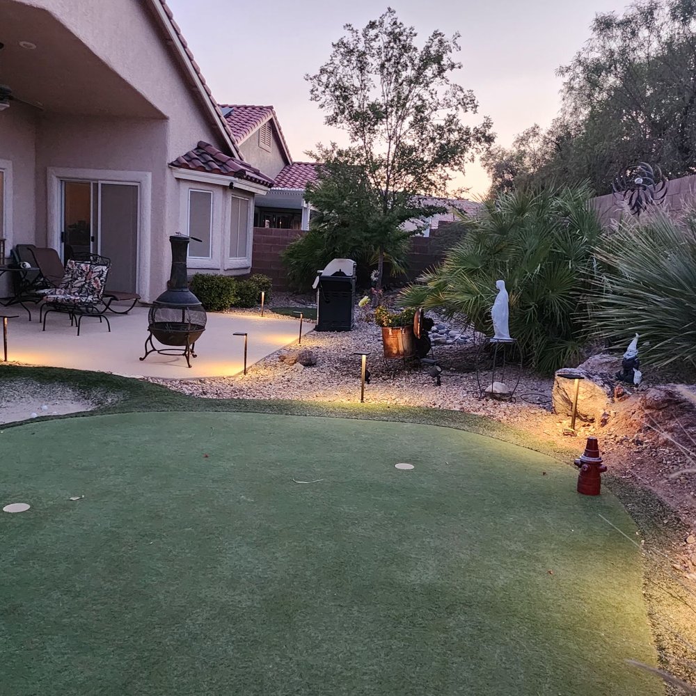 Rob's Lawn - Backyard with new lighting. - Irrigation Near Me