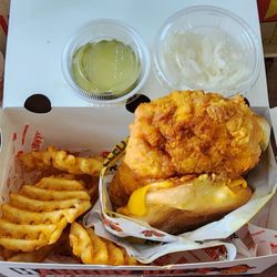 Hangry Joe's Hot Chicken & Wings - Spicy Chicken sandwich with waffle fries with side of pickles and slaw. Spice level Hot
